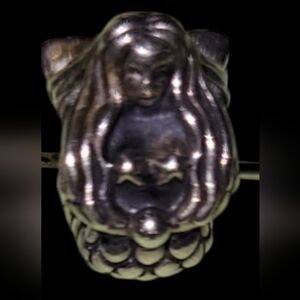 Silver Figurine with Long Hair